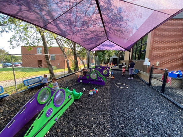Children play on a playground at FMDNS
